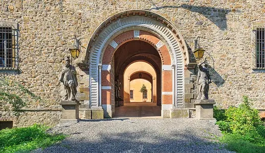The great gate of Il Castello di Piacenza, flanked by guardian statues
